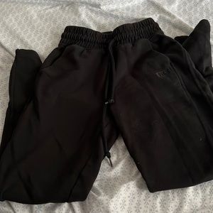 Victoria secret black sweat pants with zippers at the bottom of the legs